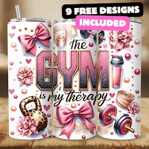 May include: White tumbler with pink accents and the text "the GYM is my therapy." The design includes pink bows, hearts, pearls, and fitness-related graphics like dumbbells and a kettlebell. The tumbler also has a straw.