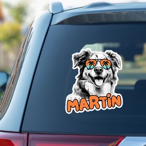 May include: A black and white illustration of a dog wearing sunglasses with palm trees reflected in the lenses. The dog is smiling and the text "MARTIN" is below the dog.
