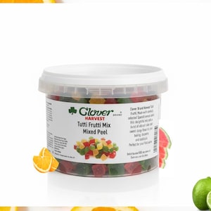 May include: A clear plastic container of Clover Harvest Tutti Frutti Mix Mixed Peel. The container is filled with colorful, diced fruit pieces. The label includes the brand name and product description. Slices of orange, watermelon, and lime are in the background.