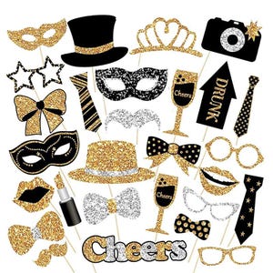 May include: A set of 20 gold and black glitter photo booth props, including a top hat, masks, glasses, lips, moustaches, bow ties, a crown, a champagne glass, a 'drunk' sign, and the word 'cheers'.