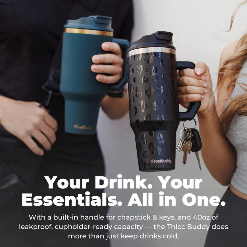 May include: Two insulated travel mugs with handles. One is teal with a gold rim, the other is black with a leopard print design. Both have a built-in handle and are designed to hold 40oz of liquid.