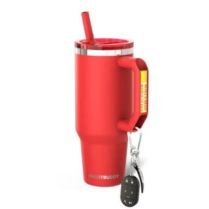 May include: A red insulated tumbler with a handle and a red straw. The tumbler has a silver rim and a white tag that says "BURT'S BEES BESWAX LIP BALM". A black remote and a key are attached to the handle.
