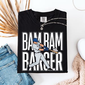 May include: A white ceramic mug with a black handle and the text "But First, Coffee" in a handwritten style. The mug is on a white surface. The mug is 10 cm tall.