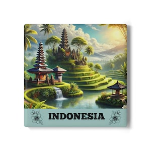 Peut inclure: Un aimant carré avec une illustration vibrante d'un paysage balinais avec des temples, des rizières et une cascade. L'aimant a une bordure bleu clair avec le mot "INDONESIA" en lettres blanches.