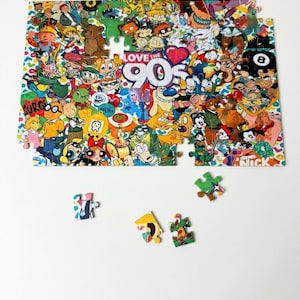 May include: A partially assembled jigsaw puzzle featuring a collage of 90s cartoon characters. The puzzle includes characters from various shows, with the text "Love the 90s" prominently displayed. Several puzzle pieces are scattered around the main puzzle.