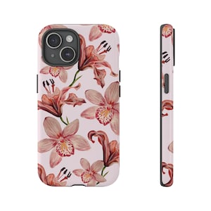 May include: A pink phone case with a floral pattern featuring pink and red orchids. The case has a black border and a cutout for the camera lens.