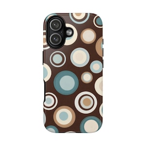 May include: A brown phone case with a retro design featuring overlapping circles in shades of blue, beige, and white. The case has a glossy finish and a camera cutout at the top. The design is reminiscent of the 1970s.