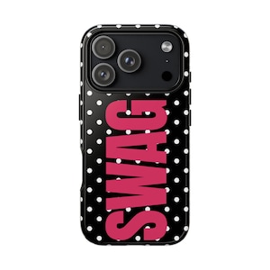 May include: Black phone case with white polka dots and the word "SWAG" in bright pink. The case has a glossy finish and a camera cutout at the top. The case is designed to fit a smartphone.