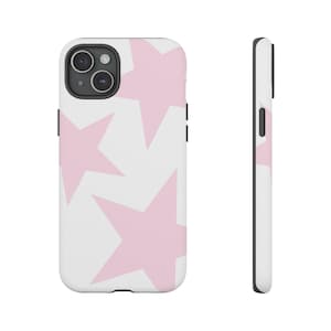 May include: White phone case featuring a pattern of large, light pink stars. The case has a black border and a camera cutout. The design is repeated on the side of the case, showcasing the pattern's continuity.