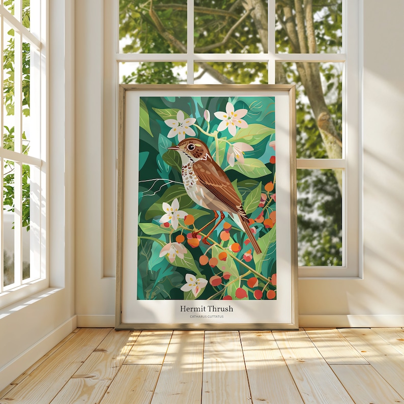 May include: Framed art print featuring a Hermit Thrush bird illustration. The artwork showcases a brown and white bird perched on a branch with red berries and white flowers against a teal and green background. The print is displayed in a gold frame.