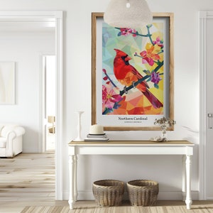 May include: A framed print of a colorful geometric illustration of a Northern Cardinal bird perched on a branch with pink flowers. The print has the text "Northern Cardinal" and "Cardinalis Cardinalis" below the image.
