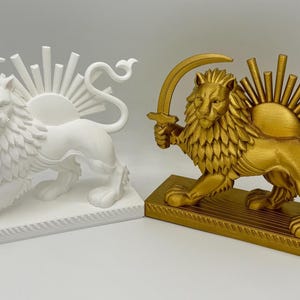 May include: Two lion statues, one white and one gold, each holding a sword and featuring a sunburst design. The statues are on rectangular bases, showcasing detailed craftsmanship and a regal theme.