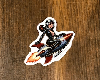 Retro pinup girl riding a rocket, vintage, retro, sticker, water proof sticker, water bottle sticker, laptop sticker, notebook sticker