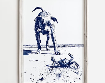 May include: A framed blue and white illustration of a dog standing on a beach looking at a crab. The dog is in the foreground and the crab is in the background.