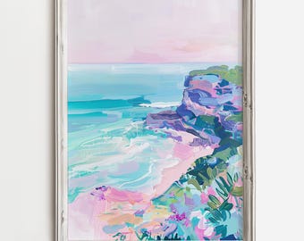 Può includere: Un dipinto astratto incorniciato di un paesaggio marino con un cielo rosa e viola, acqua turchese e una scogliera rocciosa con vegetazione verde. Il dipinto è in una cornice bianca.
