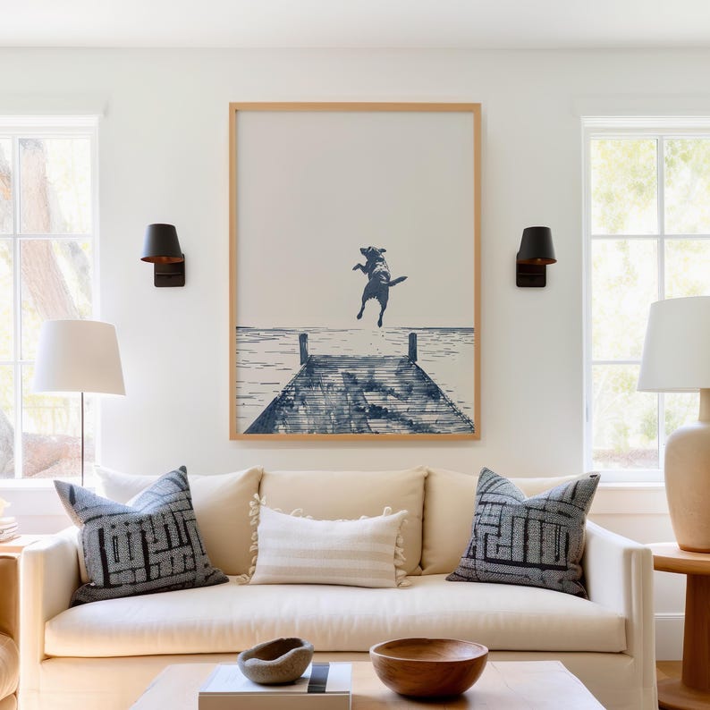 a living room filled with furniture and a painting on the wall