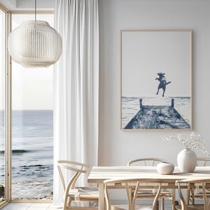 a picture of a person jumping off a dock into the ocean