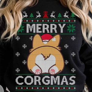 May include: Black Christmas jumper with a white, green and red pattern. The jumper features a cartoon image of a corgi's rear end wearing a Santa hat. The text "Merry Corgmas" is printed on the jumper.