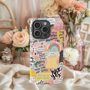 May include: A white phone case with a colorful design featuring inspirational quotes and phrases like "positive energy", "choose joy", "never forget your own worth", "be proud of how hard you are trying", and "you can do hard things well".