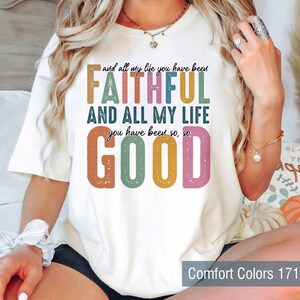 May include: White t-shirt with a colorful graphic that reads "and all my life you have been FAITHFUL AND ALL MY LIFE you have been so, so GOOD".
