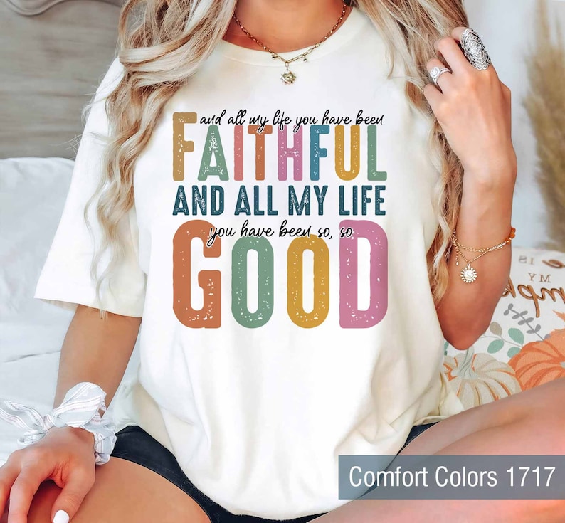 May include: White t-shirt with a colorful graphic that reads "and all my life you have been FAITHFUL AND ALL MY LIFE you have been so, so GOOD".
