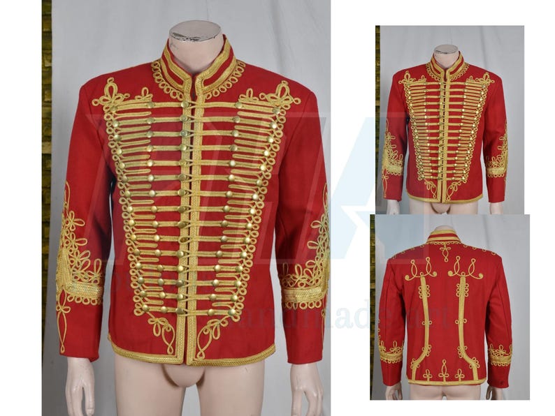 May include: A red military-style jacket with gold embroidery and trim. The jacket features a high collar, rows of gold buttons, and ornate gold detailing on the sleeves and back. The jacket is displayed on a mannequin.