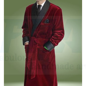 May include: A long, red velvet robe with a black velvet collar and a black tie. The robe has a quilted pattern on the inside of the collar and pockets.