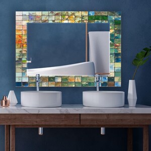 a bathroom with two sinks and a mirror