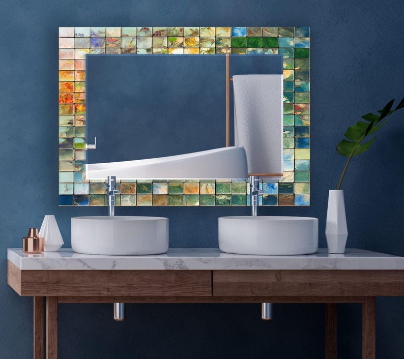 a bathroom with two sinks and a mirror