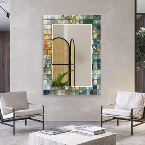 a living room with a mirror and chairs