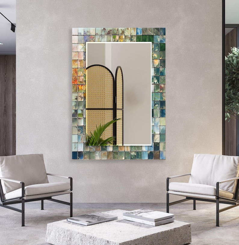 a living room with a mirror and chairs