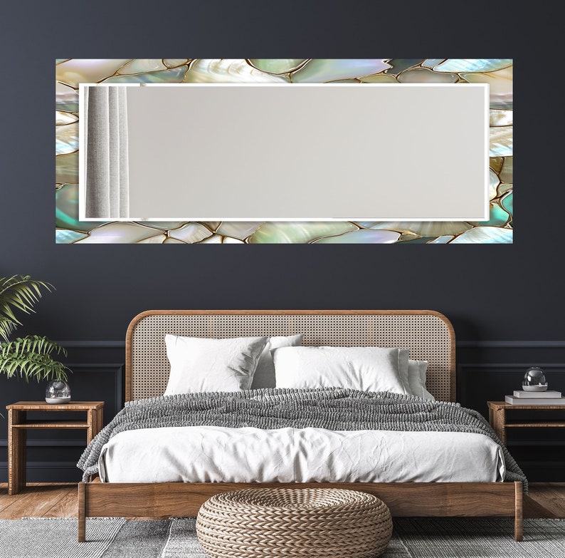 Elegant glass wall mirror with reflective pearl-inspired frame