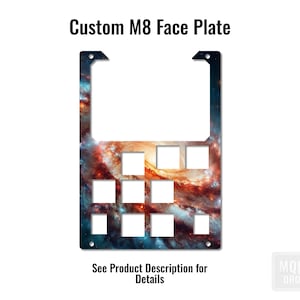 May include: Custom M8 faceplate with a galaxy-themed design. The faceplate has a black background with a swirling nebula in shades of orange, red, and blue. The faceplate has a grid of nine rectangular cutouts for switches or knobs.