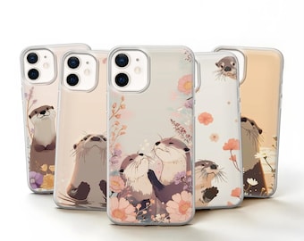 May include: Five clear smartphone cases featuring illustrations of brown otters and various pink, orange, and purple flowers. Each case displays a different arrangement of otters and floral patterns, with cutouts for dual rear camera lenses.