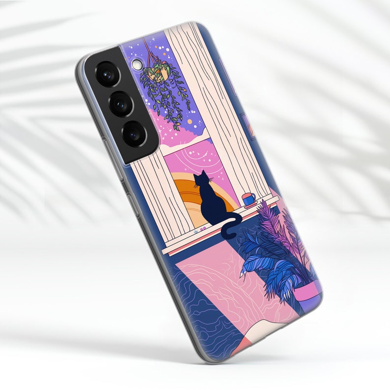 May include: A phone case with a colorful illustration of a cat sitting by a window with a plant hanging from the ceiling. The window has a view of a starry sky and a rainbow.