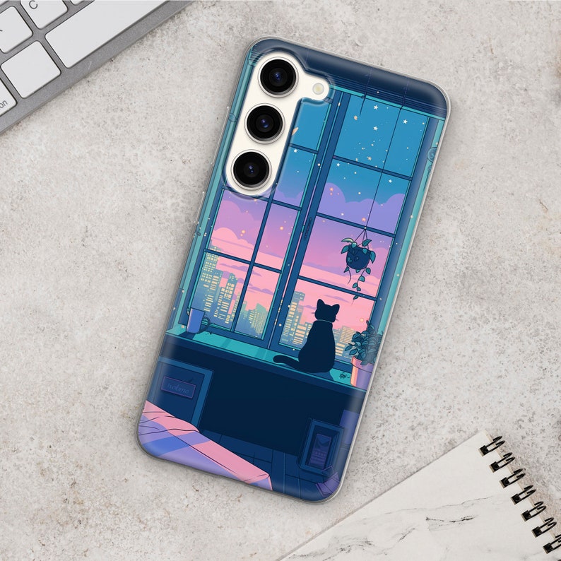 May include: A black phone case with a colorful illustration of a cat sitting by a window with city lights in the background. The case has a triple camera lens on the back.