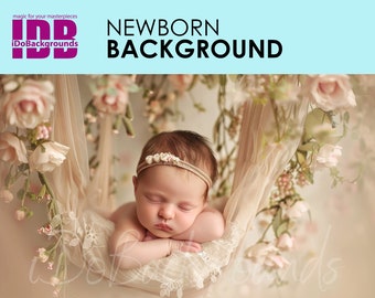 May include: A sleeping newborn baby girl wearing a headband with pearl accents lies in a white fabric hammock surrounded by pink flowers.