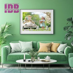 May include: A framed photograph of a young girl in a green dress holding a basket of Easter eggs. She is standing in front of a white vintage car decorated with Easter eggs. Two white rabbits are in the grass behind her.