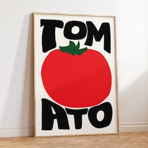May include: A white poster with the word "TOMATO" in black letters with a red tomato in the centre. The tomato has a green stem and leaves.