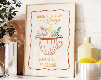 May include: A framed print with a colourful illustration of a coffee cup with flowers and the text "When life gives you lemons, have a cup of coffee."