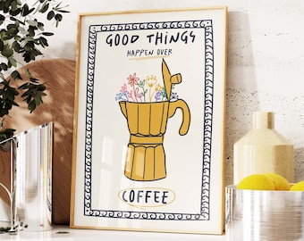 May include: A framed print with a white background and a black border. The print features a yellow coffee pot with colorful flowers inside. The text "Good Things Happen Over Coffee" is written in black lettering.