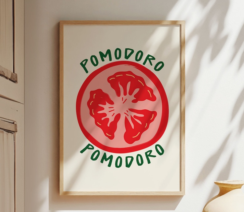 Puede incluir: Una impresi&oacute;n enmarcada con una ilustraci&oacute;n de tomate rojo y rosa y el texto "POMODORO" en letras verdes.