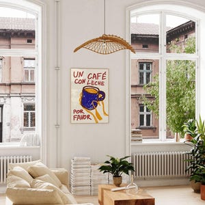 以下が含まれることがあります： スペイン語で「Un cafe con leche por favor」と書かれたカラフルなポスター。青いコーヒーカップを手に持ち、中に茶色の液体が入っています。