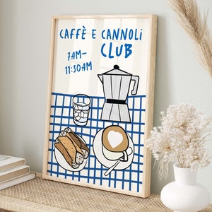 May include: A framed illustration of a blue and white checkered tablecloth with a coffee pot, a glass of water, a plate of cannoli, and a cup of cappuccino. The text "Caffe e Cannoli Club" and "7AM-11:30AM" is printed on the illustration.