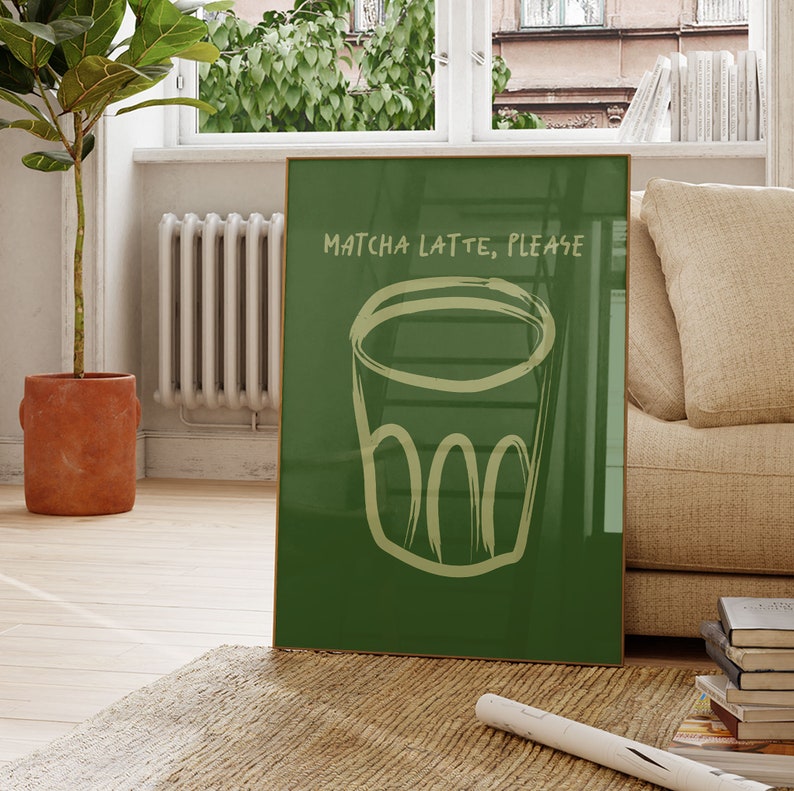 May include: A green framed poster with the text "Matcha Latte, Please" and a hand-drawn illustration of a cup of matcha latte.