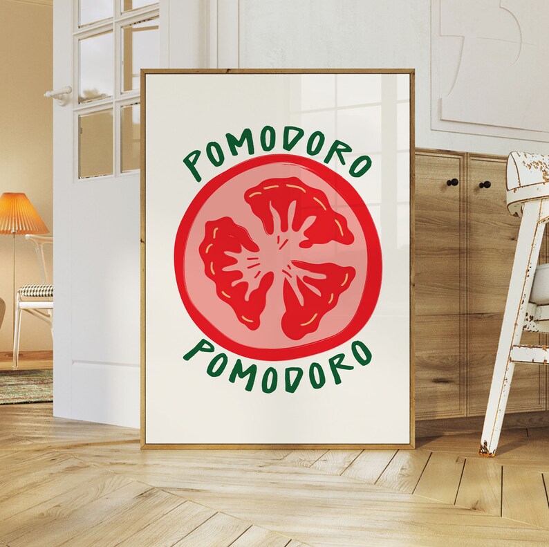 Puede incluir: Un p&oacute;ster enmarcado blanco con una ilustraci&oacute;n de rodaja de tomate roja y el texto "POMODORO" en letras verdes.