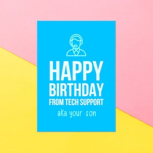 May include: A blue card with a white outline of a person wearing a headset. The text on the card reads "Happy Birthday from Tech Support aka your son."