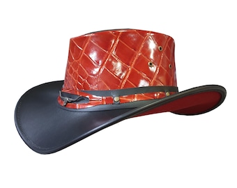 May include: A cowboy hat featuring a black brim and a red, textured crown. The crown has a diamond pattern and is accented with a black band. The hat has a red interior.