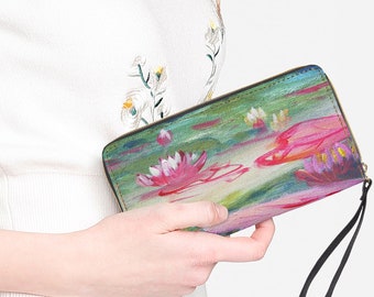 Faux leather clutch bag with artistic print