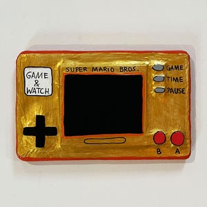 Game & Watch approximatif en papier, carton et bois - Super Mario Bros Orange et Or